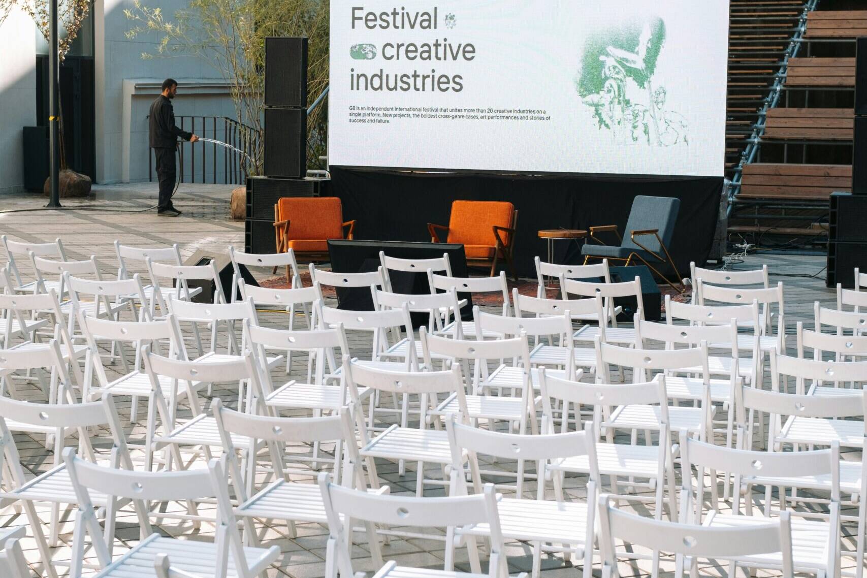 Outdoor seating setup for conference with a projector
