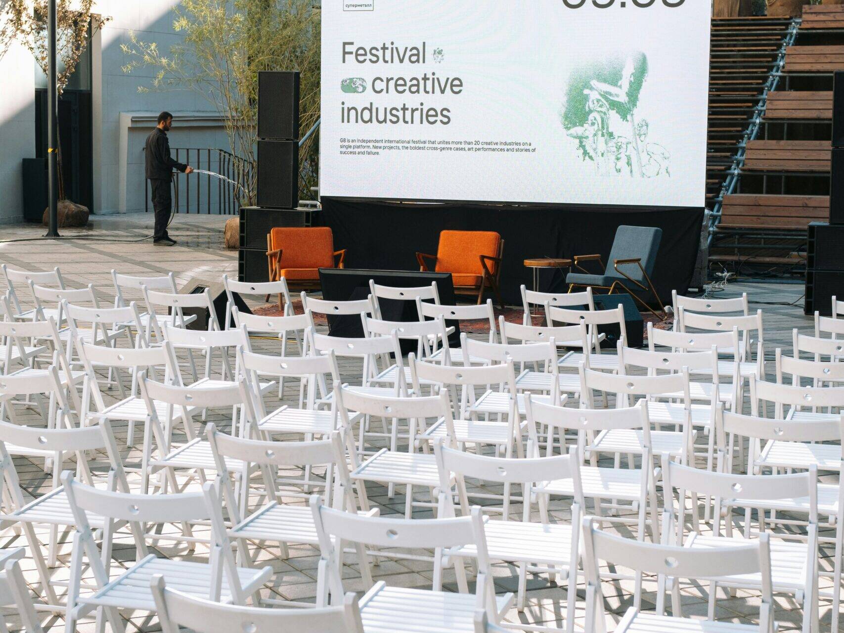Outdoor seating setup for conference with a projector