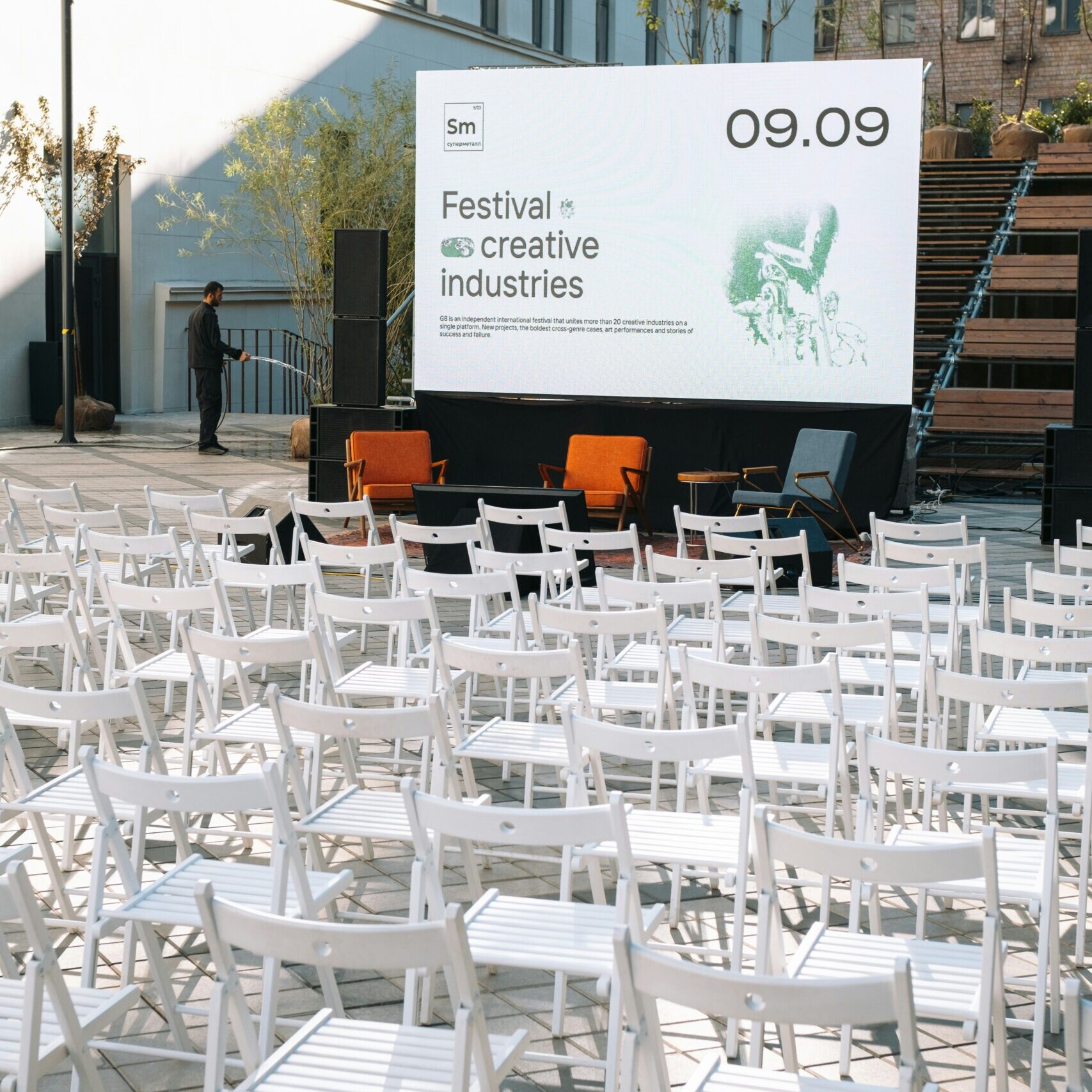 Outdoor seating setup for conference with a projector