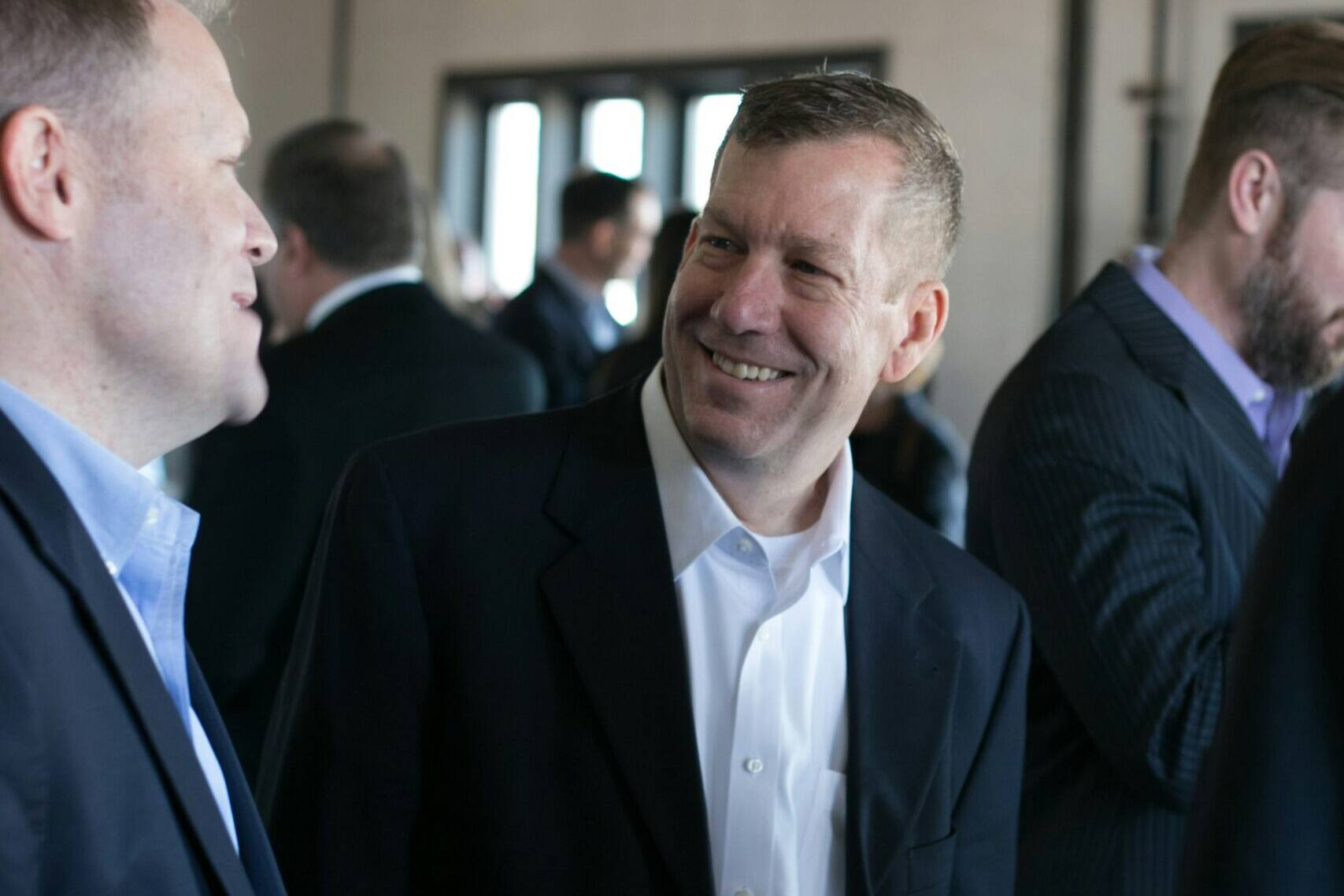 Men in suit at corporate event
