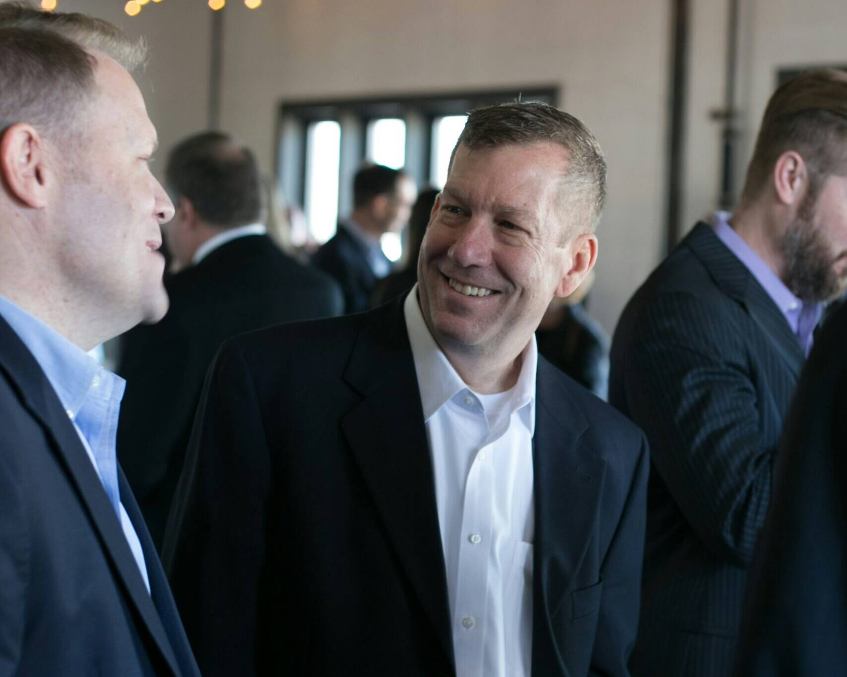 Men in suit at corporate event