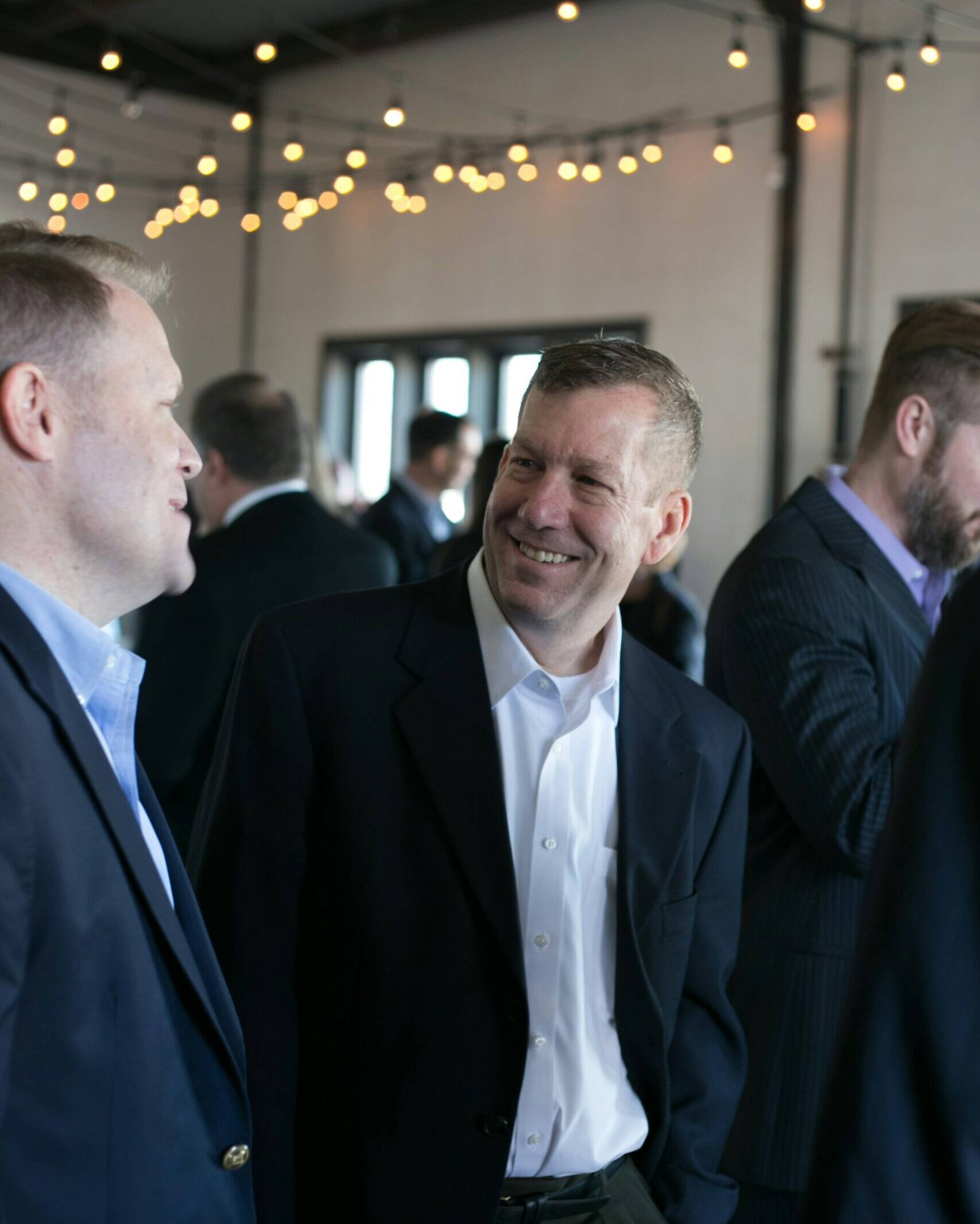 Men in suit at corporate event