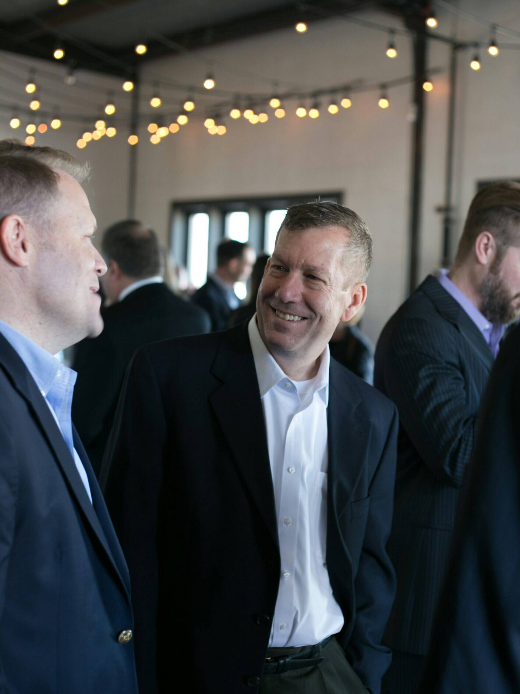 Men in suit at corporate event